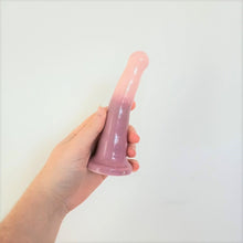 Load image into Gallery viewer, A hand holds a 5 inch curved ceramic dildo in a pink and light purple gradient pattern in front of a white background