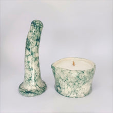 Load image into Gallery viewer, A handmade ceramic massage candle and a 6 inch curved ceramic dildo in a dark green bubble pattern stand in a white photo booth.
